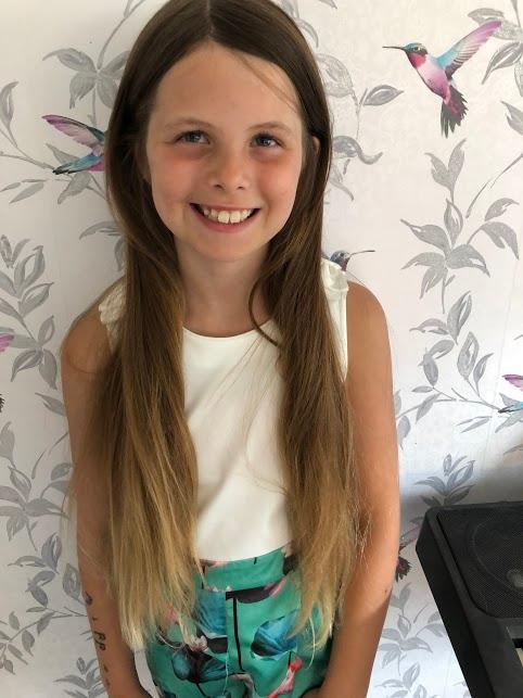 WB in Tiger class has raised so far £580 for the Little Princess Trust by having her lovely long locks cut off.